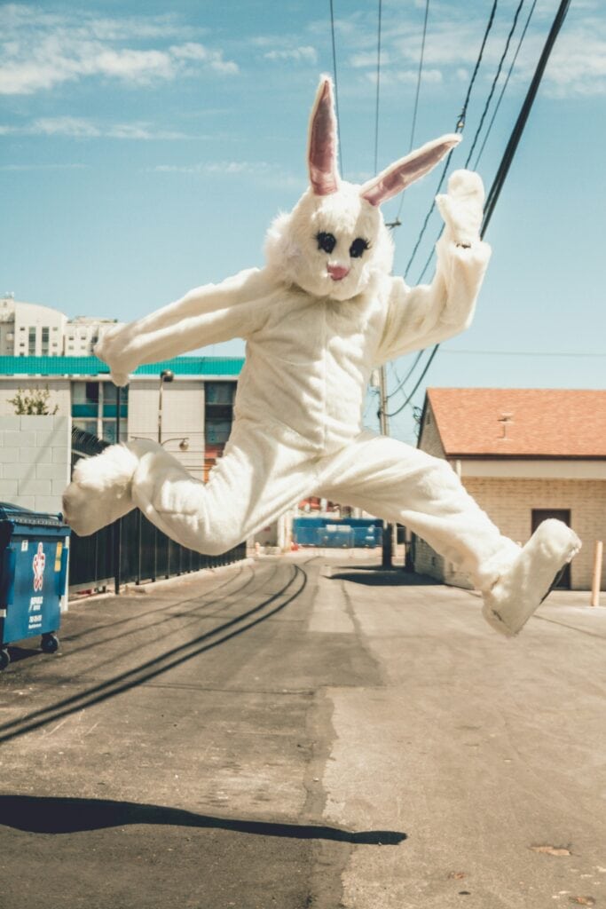 Osteopath demonstrating proper Easter egg hunt posture techniques at Body Beliefs Billericay